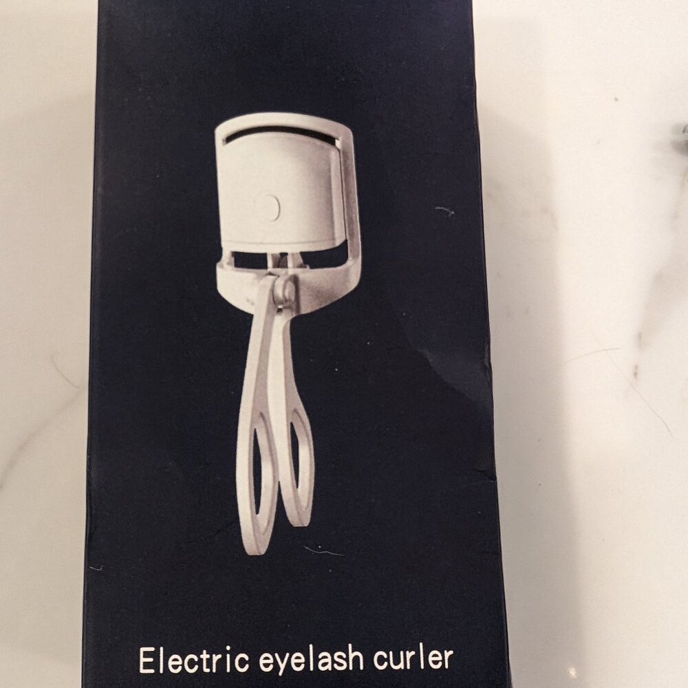Heated eyelash curler brand new